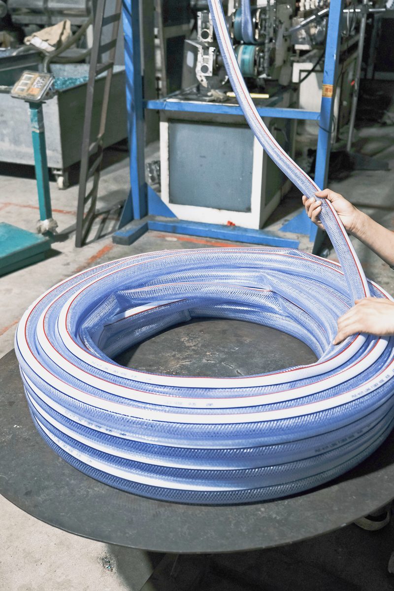 Packing PVC hose into export cartons